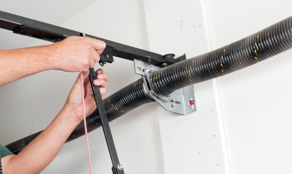 A broken garage door torsion spring